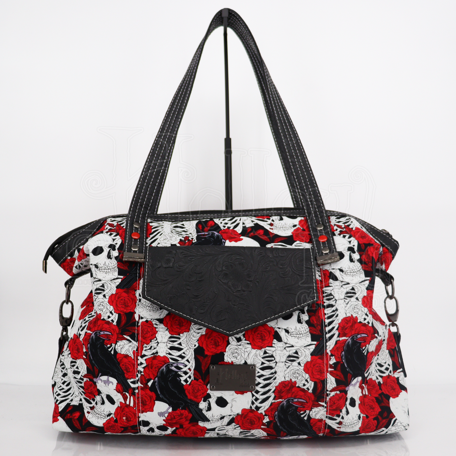 Large expandable handbag or overnight bag made with vinyl and cotton fabrics with waterproof canvas lining and gunmetal hardware